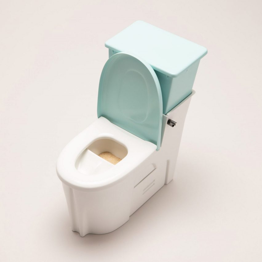 Scale model of Sandi toilet made of white and aqua-coloured plastic