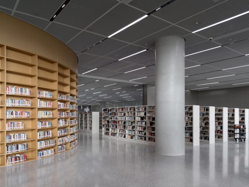 Bookshelves in library with concrete floors