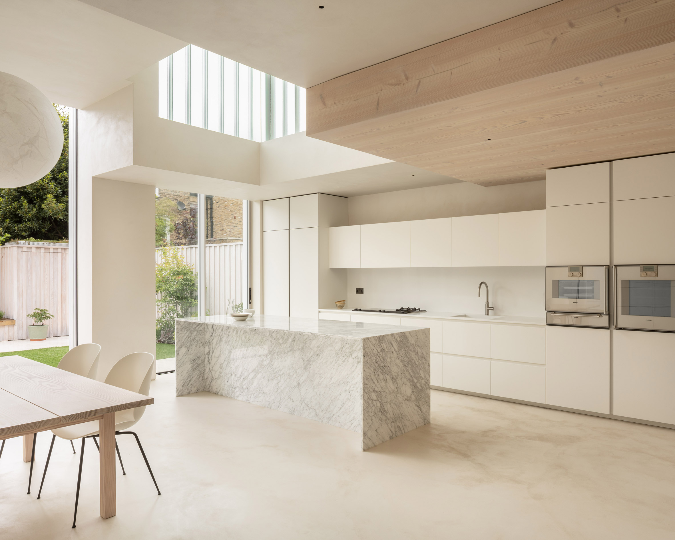 White kitchen with marbled island