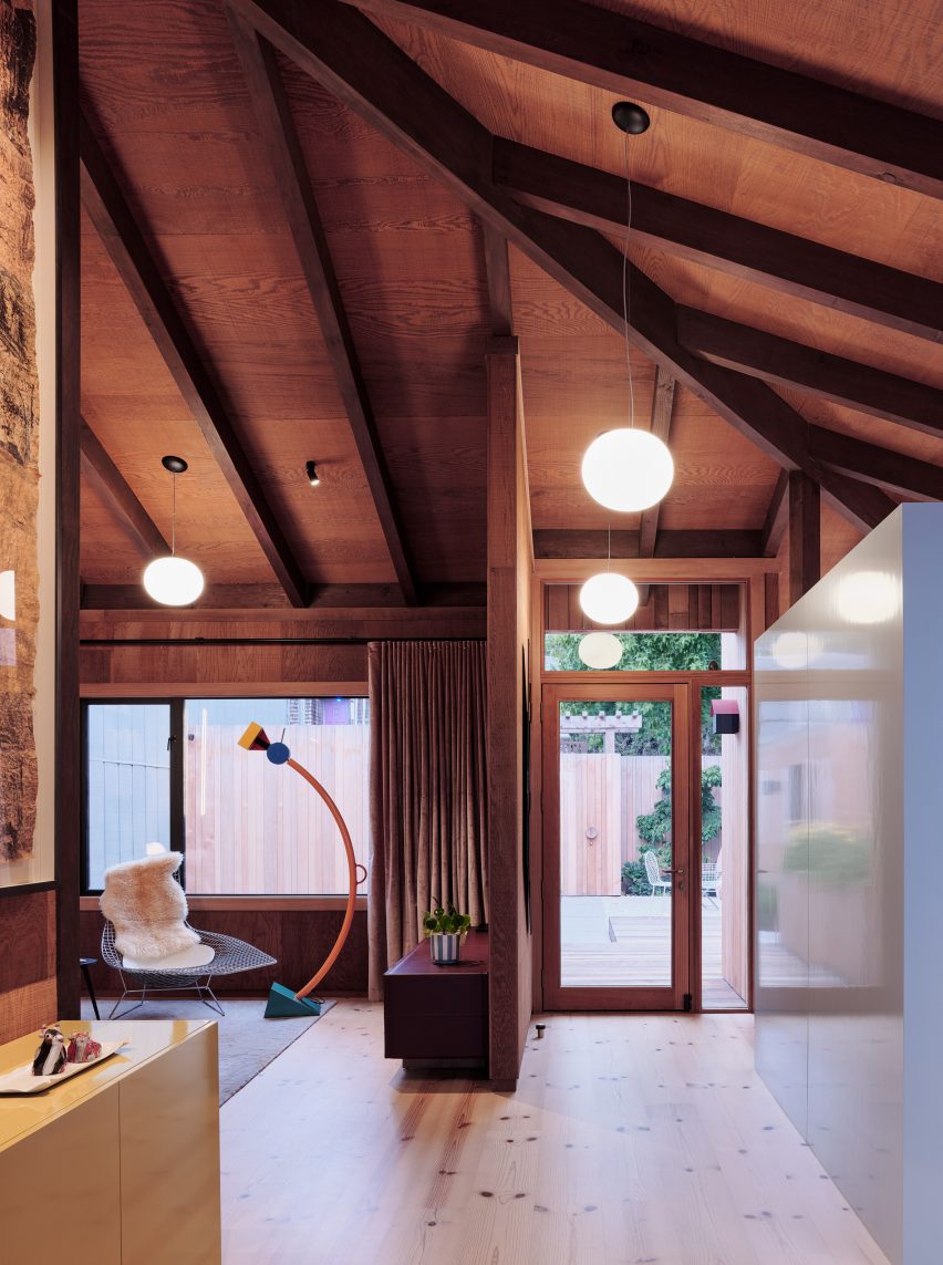 Noe Valley home with exposed timber beams in ceiling and sculptural lamp