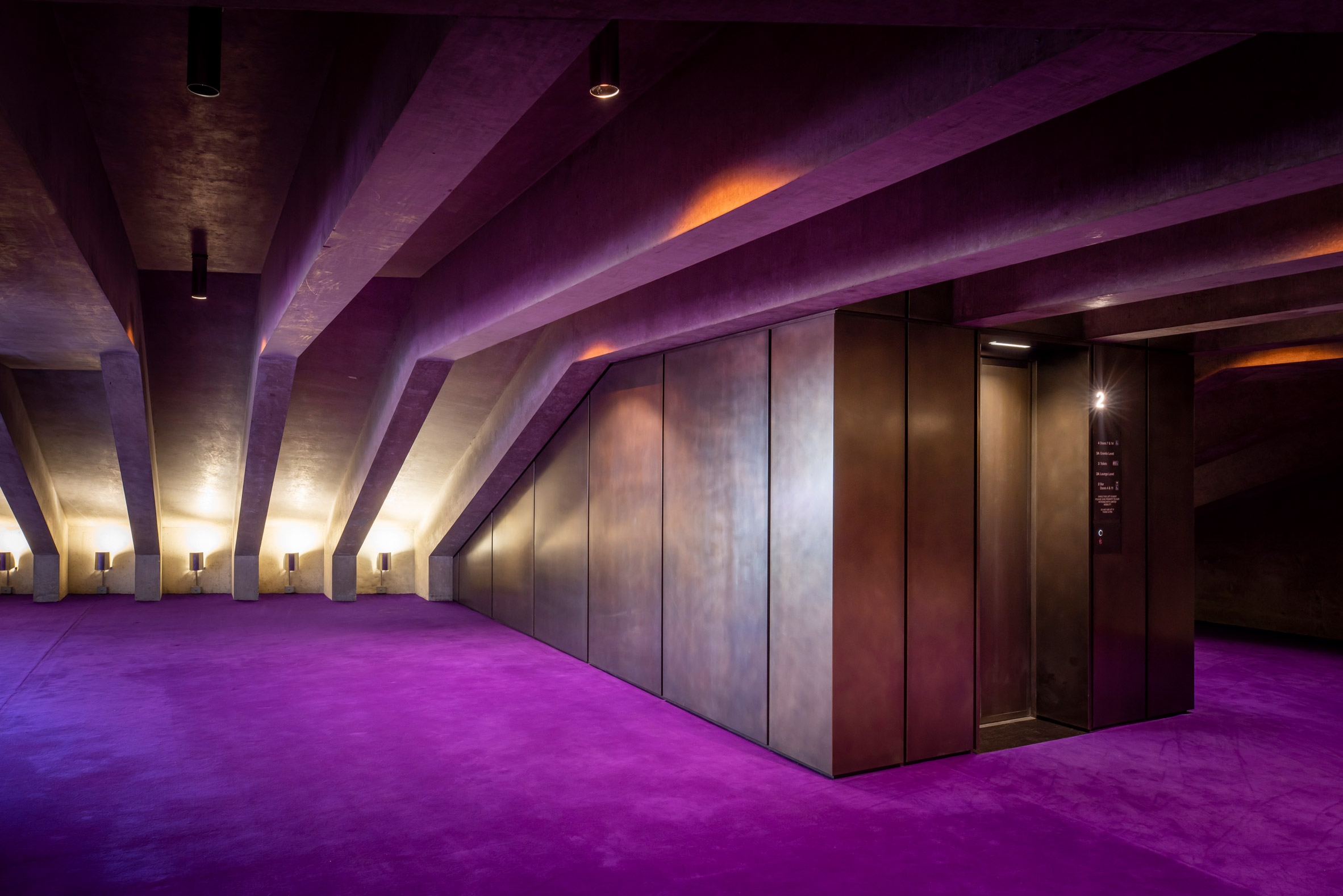 Circulation space inside Sydney Opera House with purple carpets