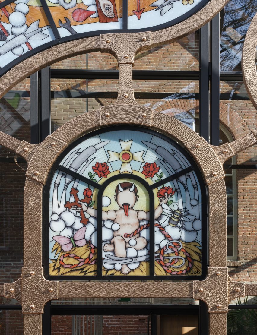 Close-up of glass window with child with devil's horns