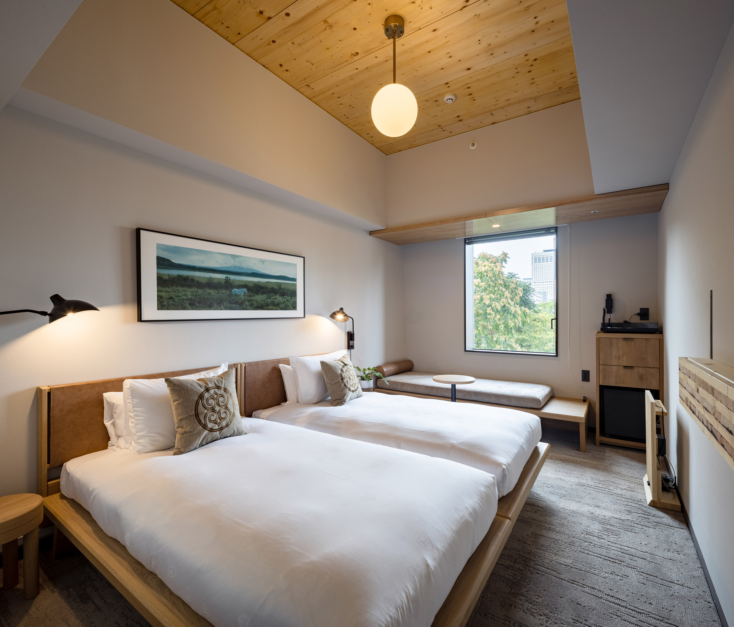 Japanese hotel bedroom with timber ceiling