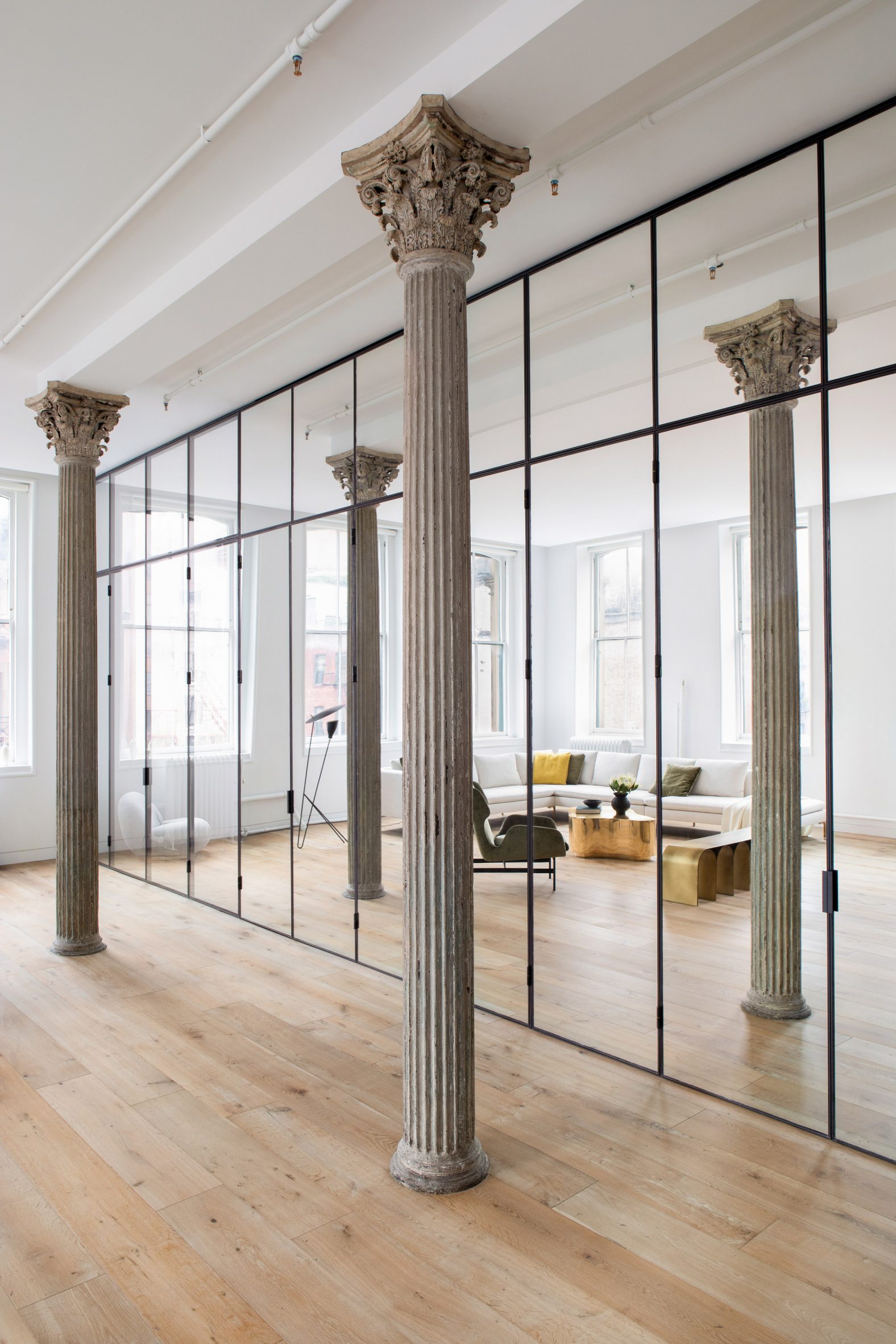 Cast-iron columns in front of mirrored wall