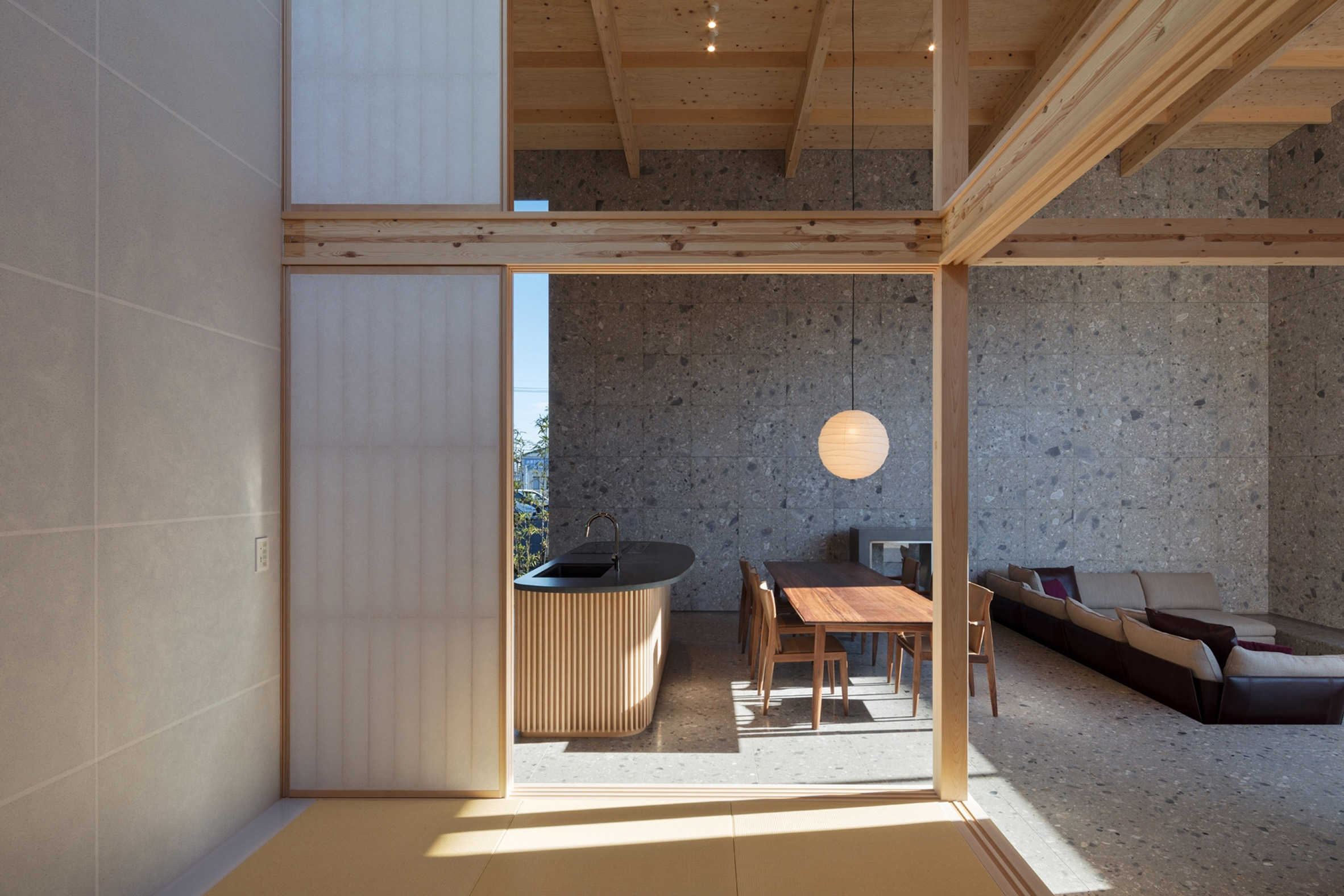 Visible timber structure in living area of Japanese house with curved desk