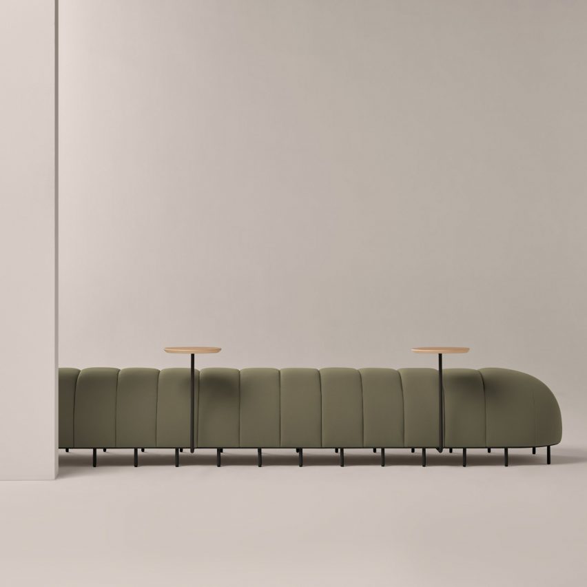 Photograph showing segmented bench in sage green upholstery
