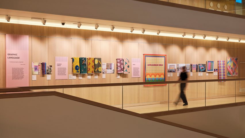 Display wall of Yinka Ilori's designs and Nigerian textiles at the Design Museum