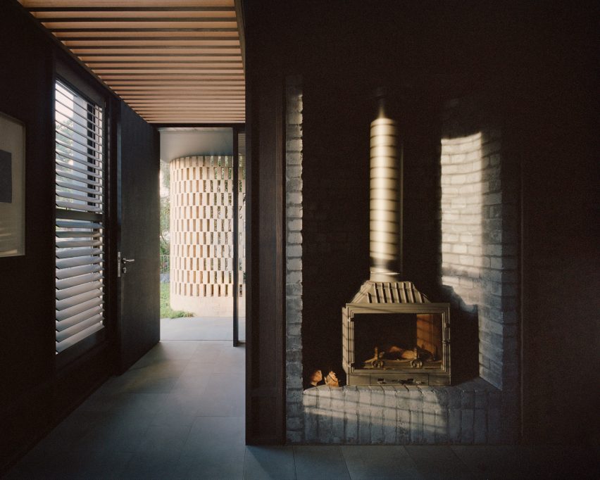 Dark-brick interior of 8 Yard House by Studio Bright