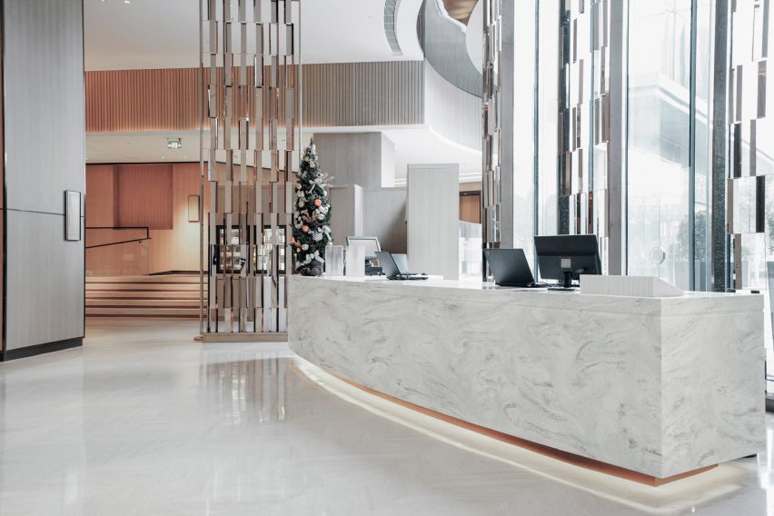 An office entrance featuring the Corian Solid Surfaces in a white and grey colour
