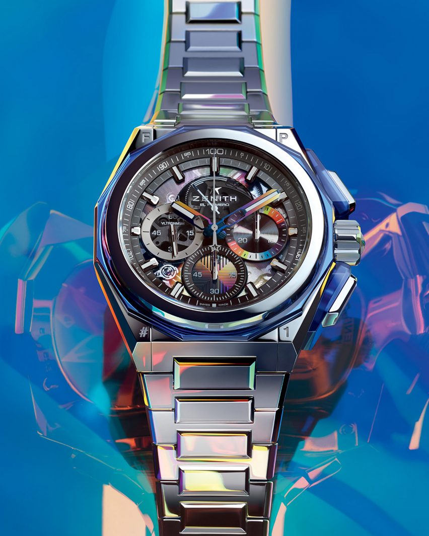 A close up photograph of the Zenith watch with a blue background