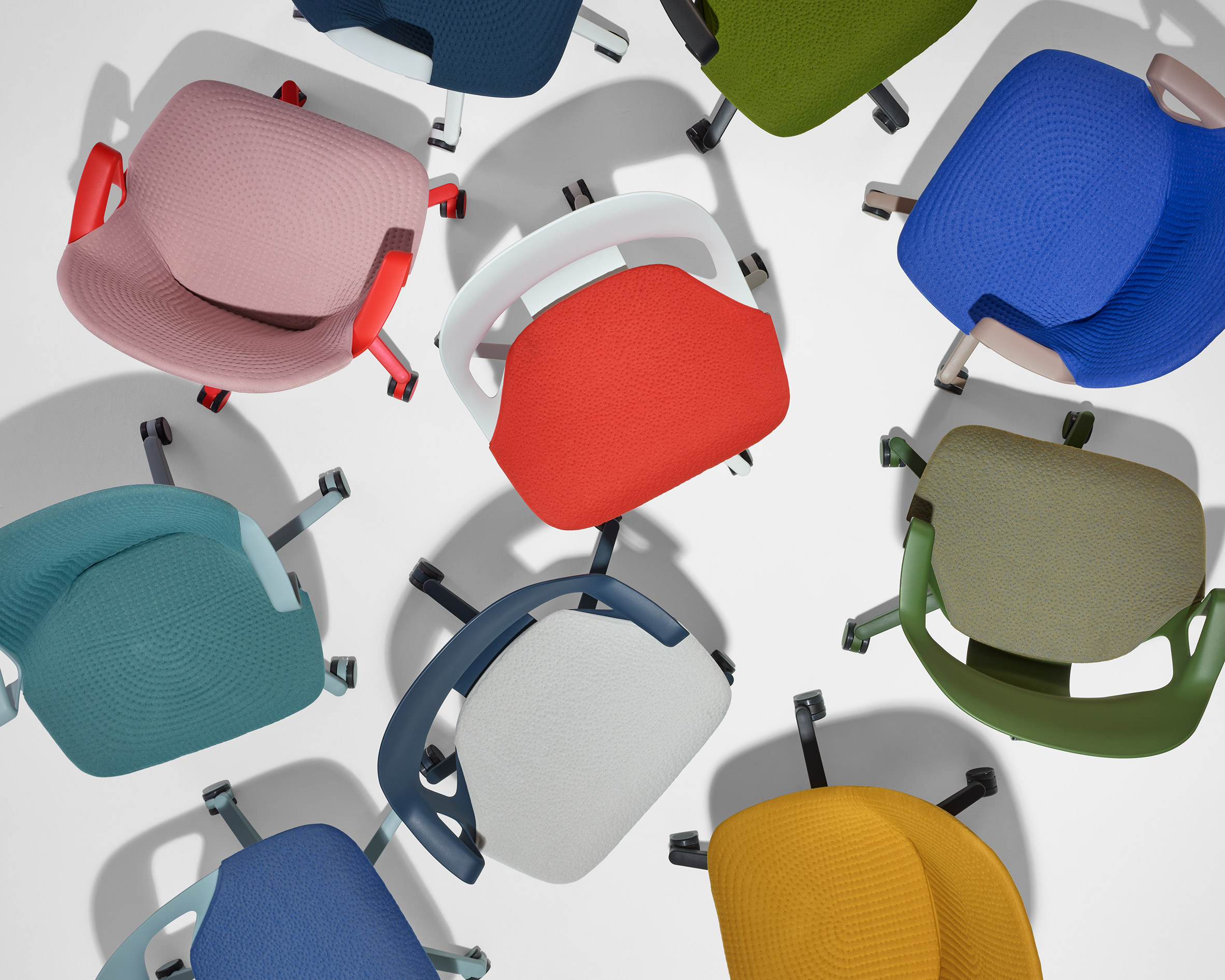 The Zeph Chair in a range of colours – blue, pink, red and green