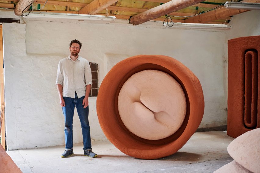 Photograph of Carl Emil with his Poly Powder sculpture in his studio 