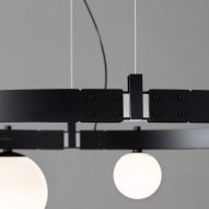 Detail of track lighting with suspension cords and LED spotlights