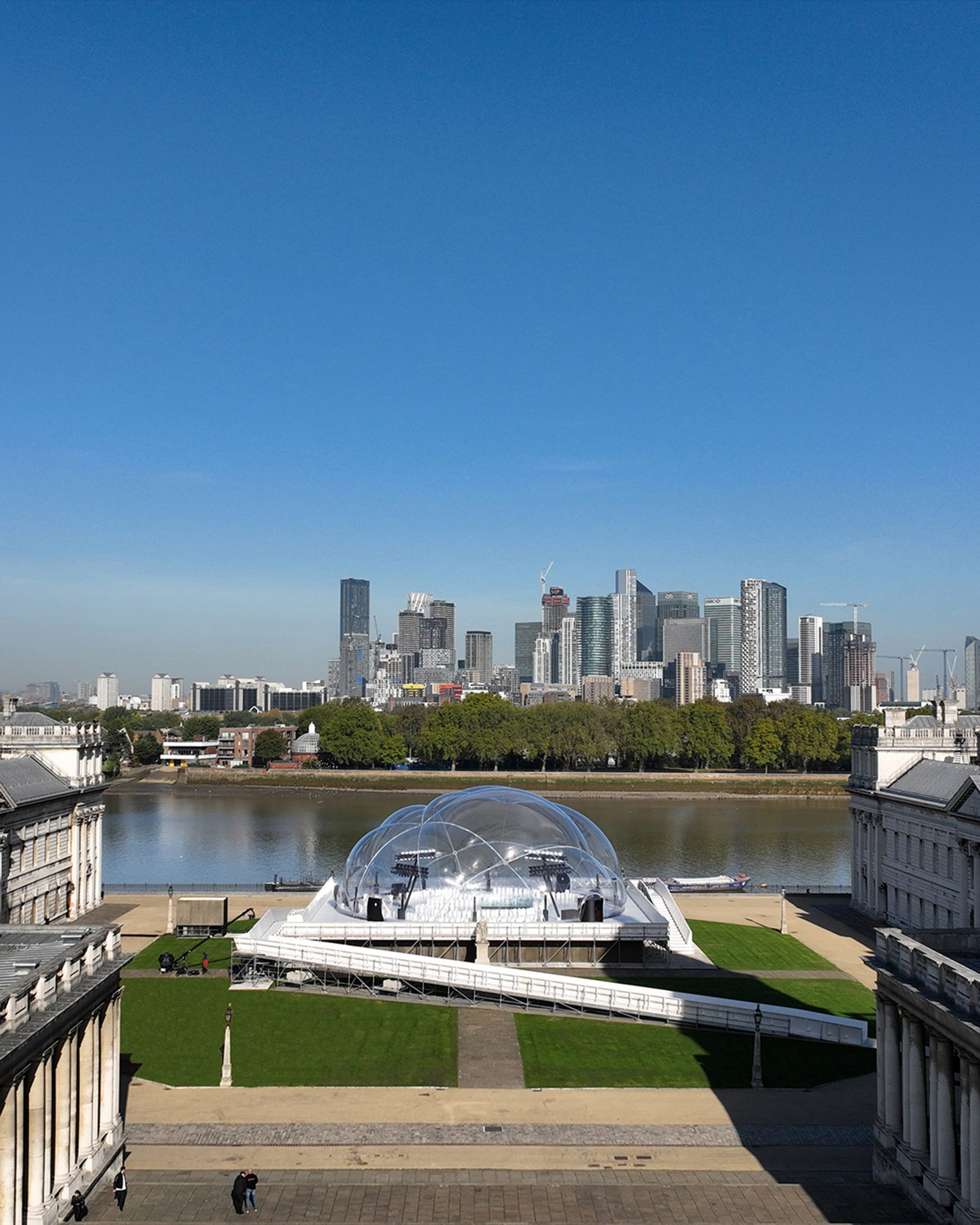 Image of the inflatable show space in front of the Thames River and London skyline