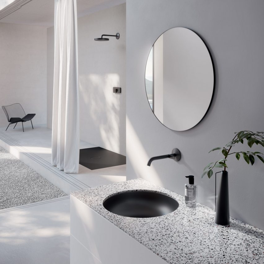 Black sunken basin in a white bathroom
