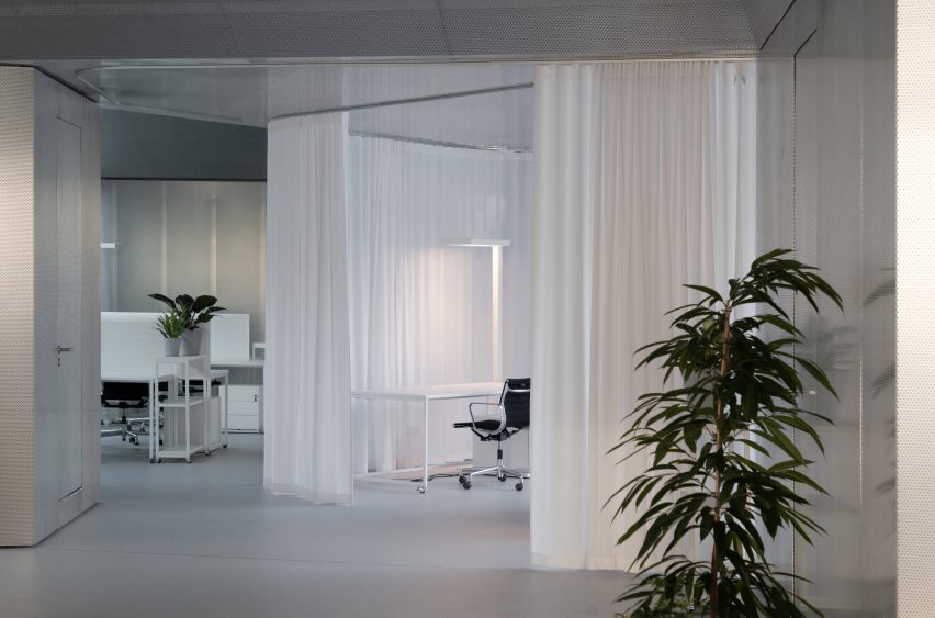 Office interior with curtain partitions