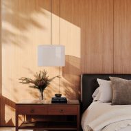 Teak-panelled bedroom in Clear Oak Residence by Woods + Dangaran