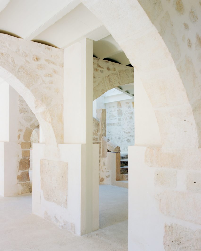 Interior image of a stone and concrete corridor at El Priorato