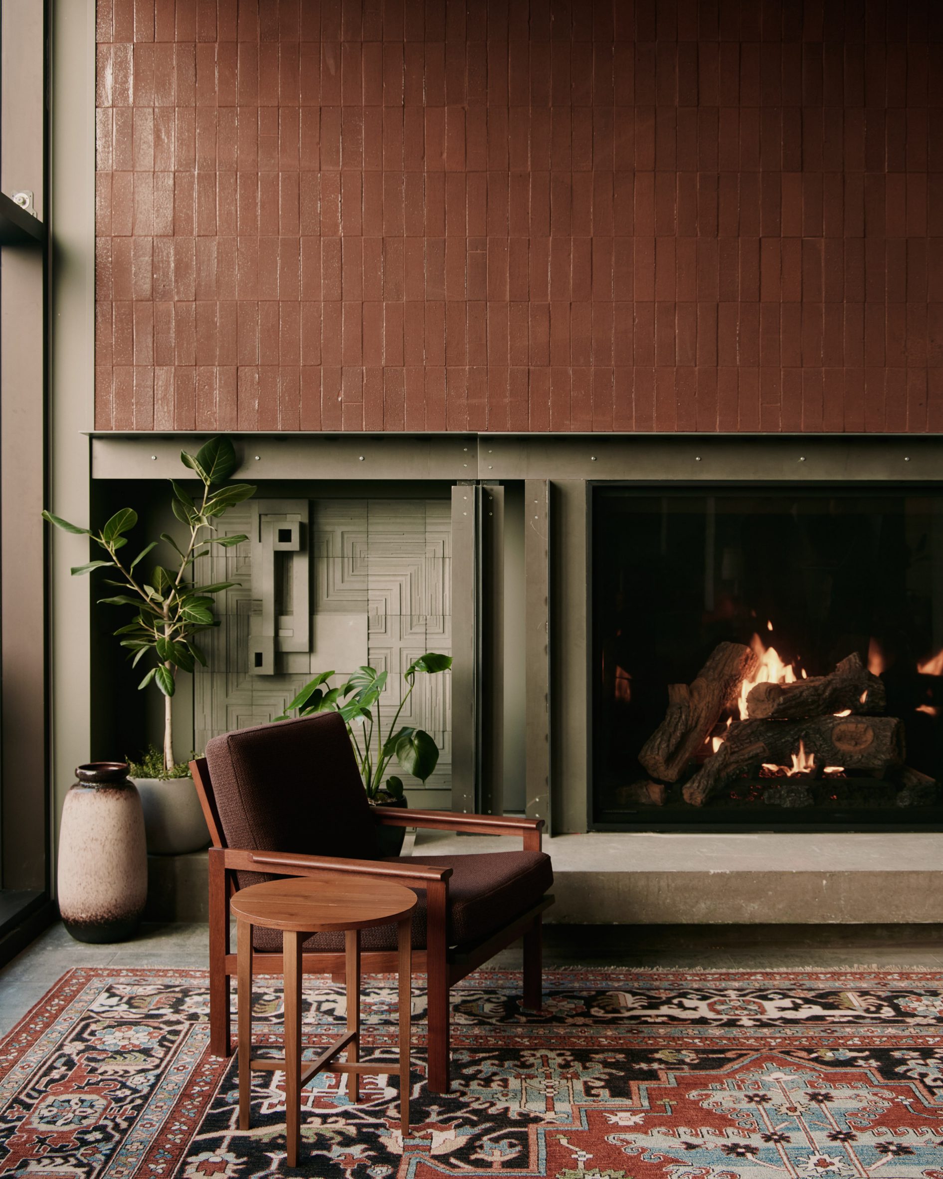 Custom ceramic tiles framing the fireplace