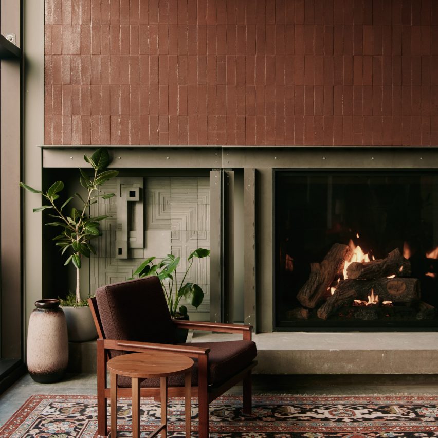 Fireplace flanked by ceramic tiles