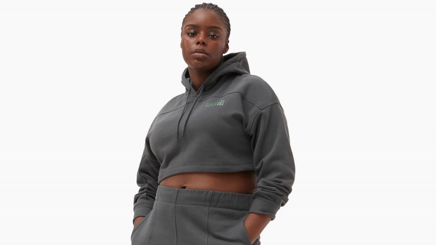 A model wearing a grey tracksuit