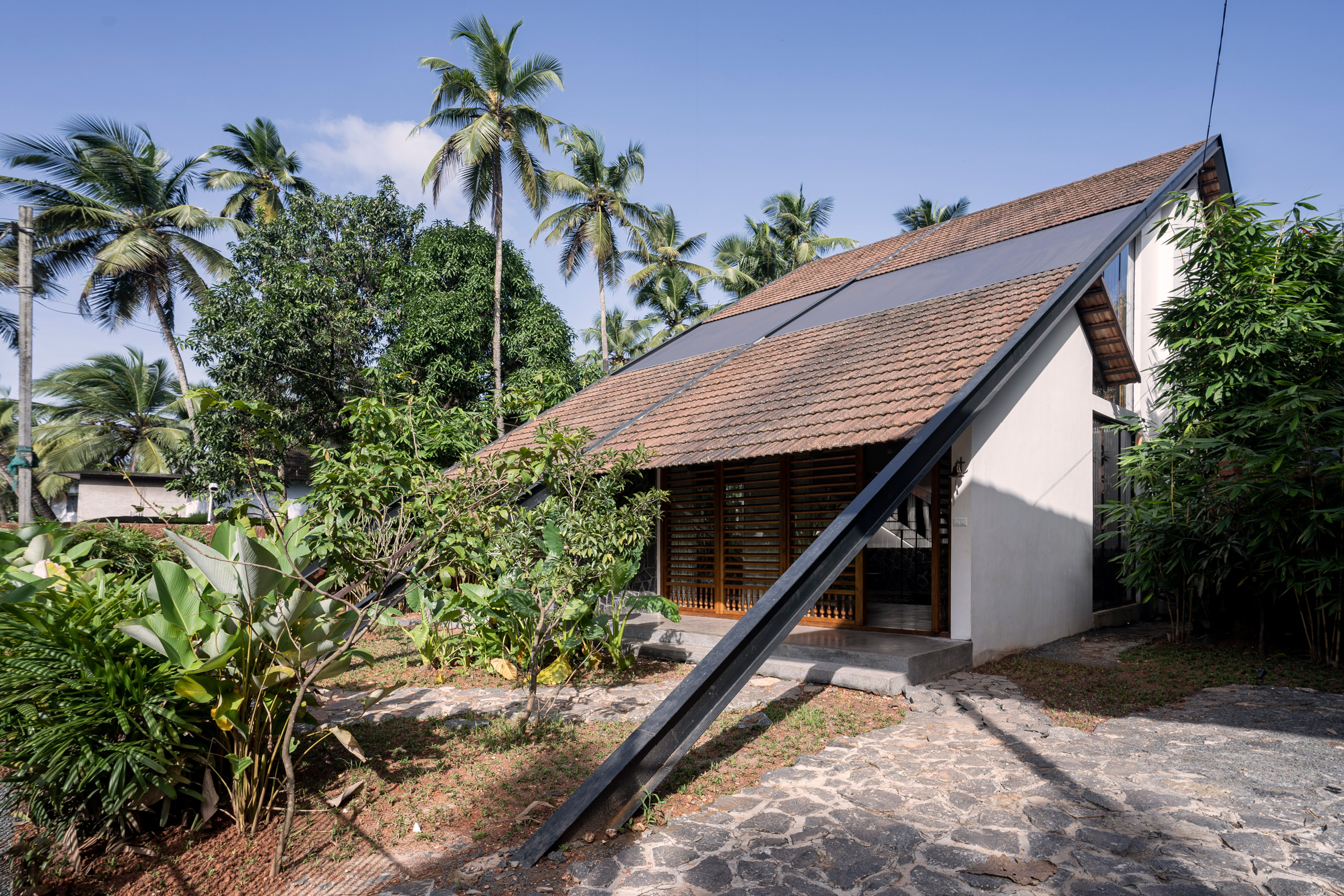 Indian home by 3dor Concepts with sloped roof