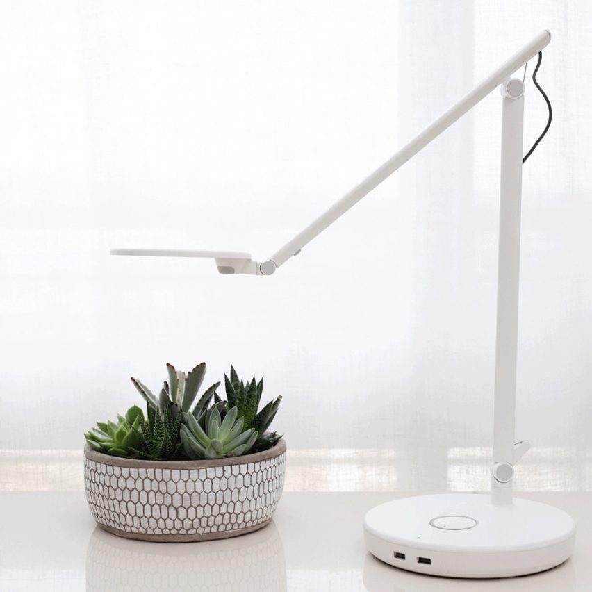 A white desk lamp by Humanscale