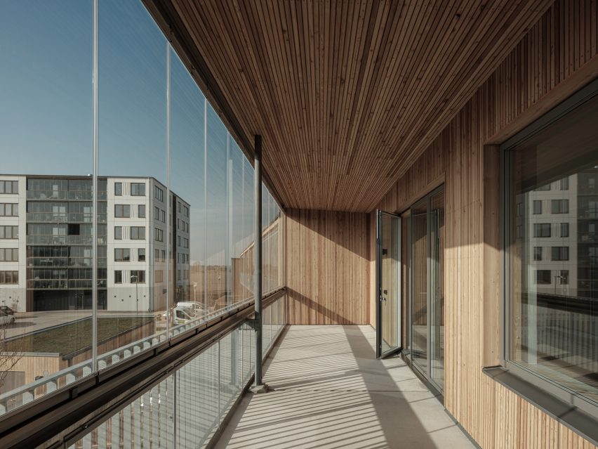 Exterior image of a screened balcony at the residential housing block