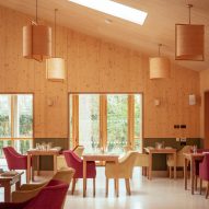 Timber-lined dining room in John Morden Centre by Mae Architects
