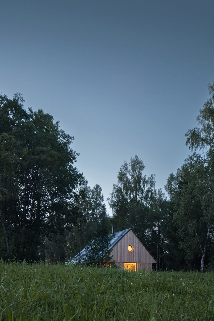 Exterior image of Lipno Lakeside Cabin surrounded by forest