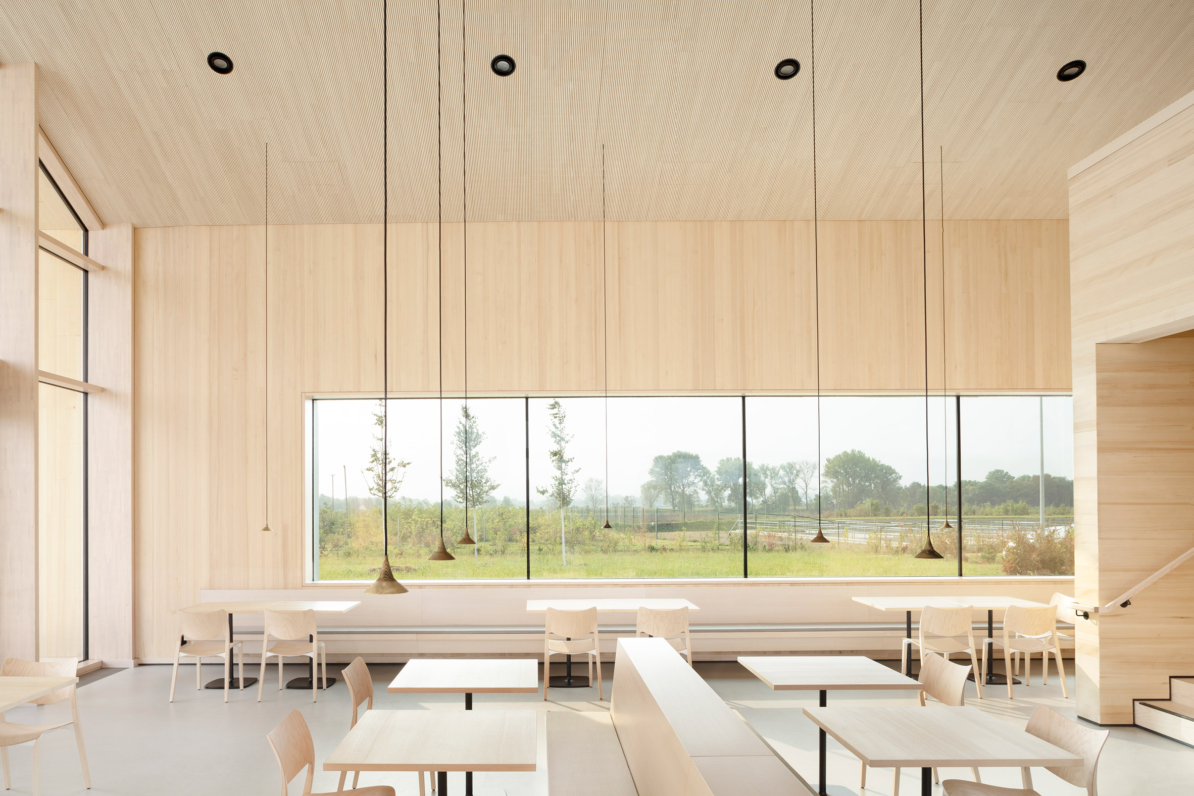 Wood-lined service station interior by MONO Architekten