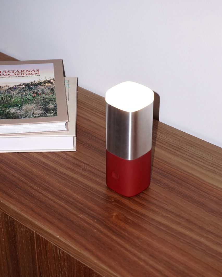 Lighthouse lamp with red base by Jacob Alm Andersson