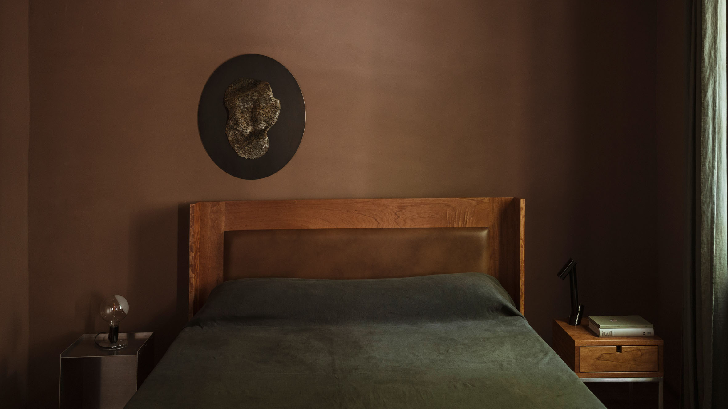 Brown bedroom with custom leather headboard