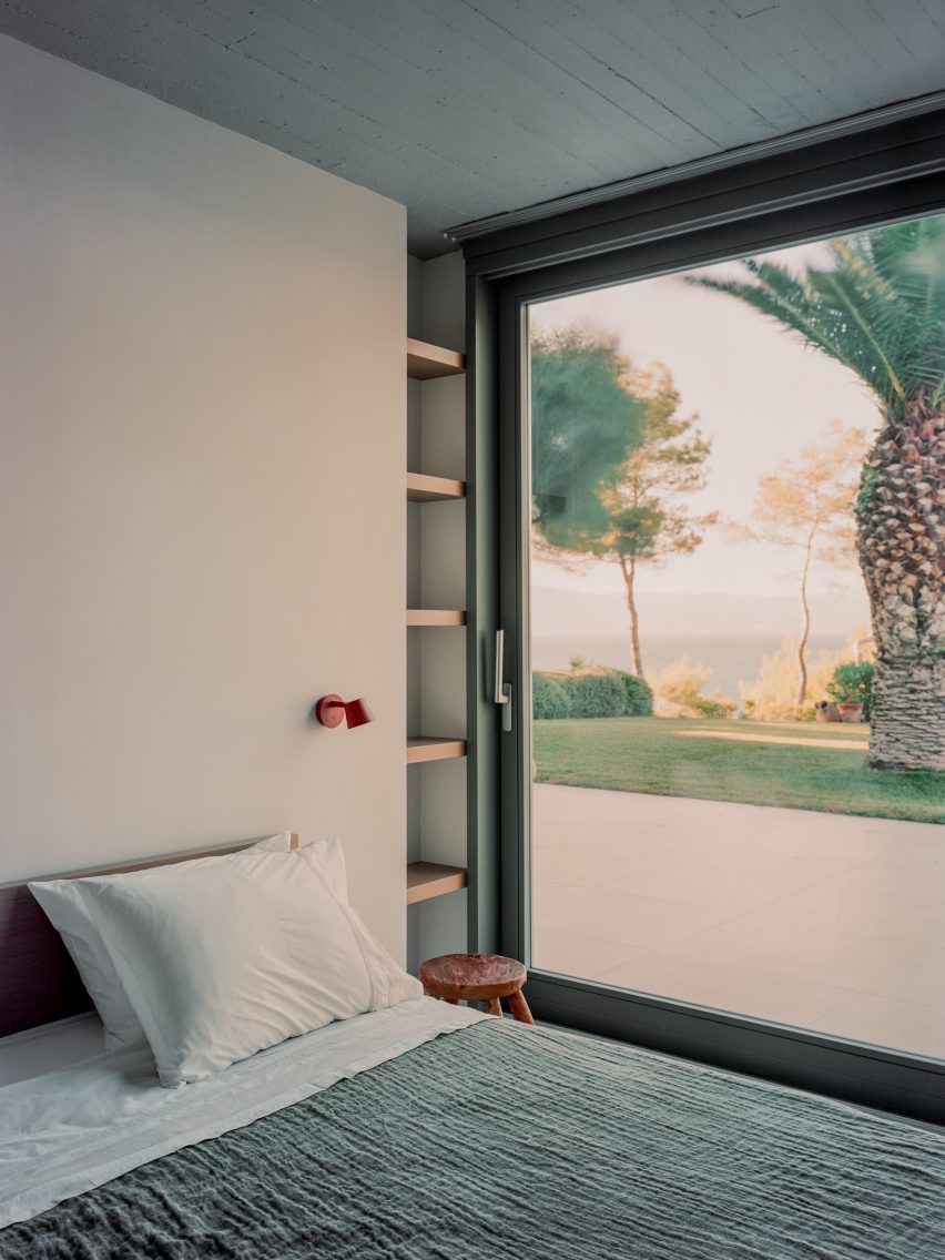 Interior image of a bedroom with ocean views at the Greek house