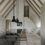 Dining table and staircase in Nieby Crofters Cottage by Jan Henrik Jansen and Marshall Blecher