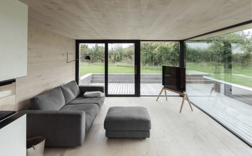 Oak-lined living room in Nieby Crofters Cottage by Jan Henrik Jansen and Marshall Blecher
