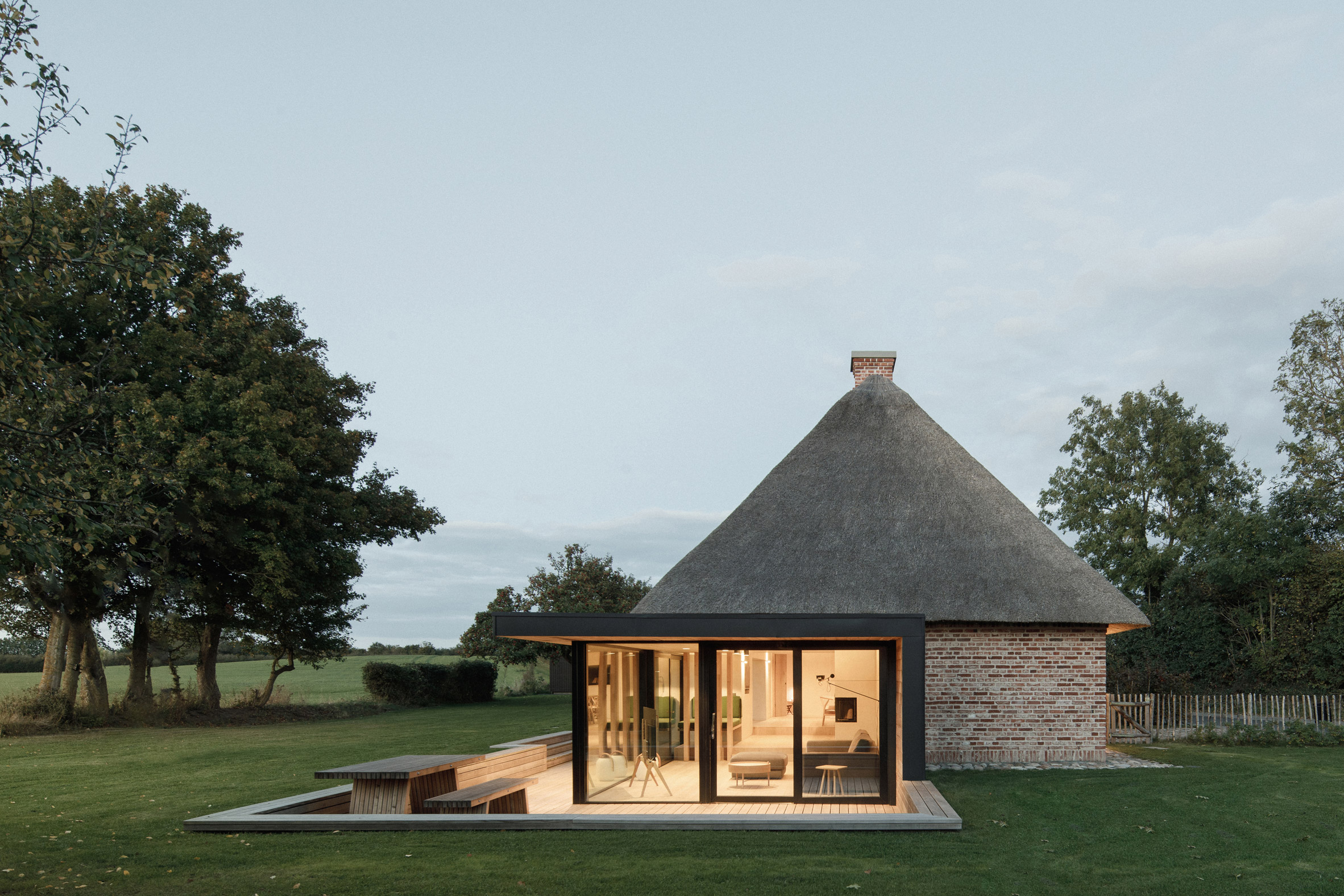 Thatched roof and glazed extension of Nieby Crofters Cottage by Jan Henrik Jansen and Marshall Blecher