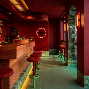 Va Bene Cicchetti bar in Warsaw by Noke Architects with all-red interior and turquoise floors