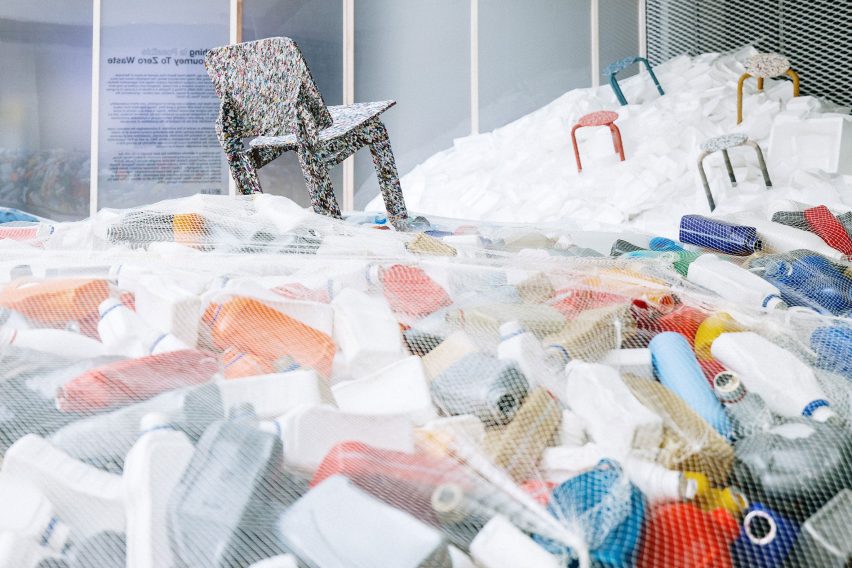 Furniture placed on piles of waste at Piles of waste at Nothing is Possible exhibition by Potato Head and OMA