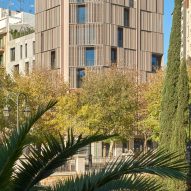Wood screens and green courtyards define apartment block in Mallorca by OHLAB