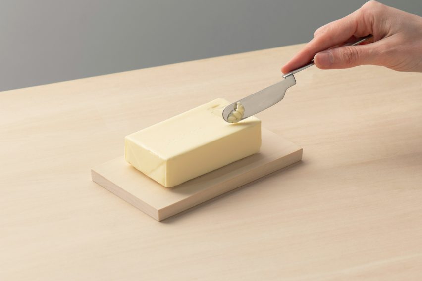 The Oku knife held to be used to scrape a block of butter