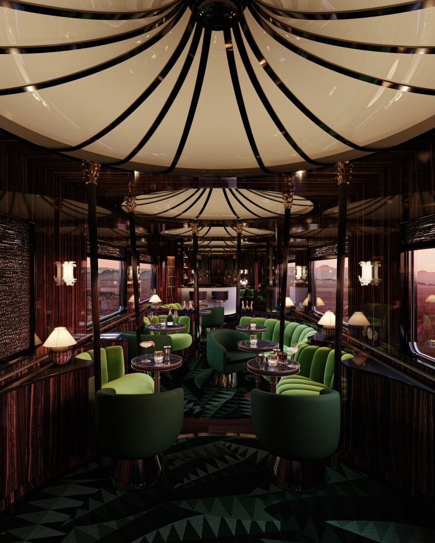 The Orient Express train's Bar Car interior with domed ceilings and bright green seating