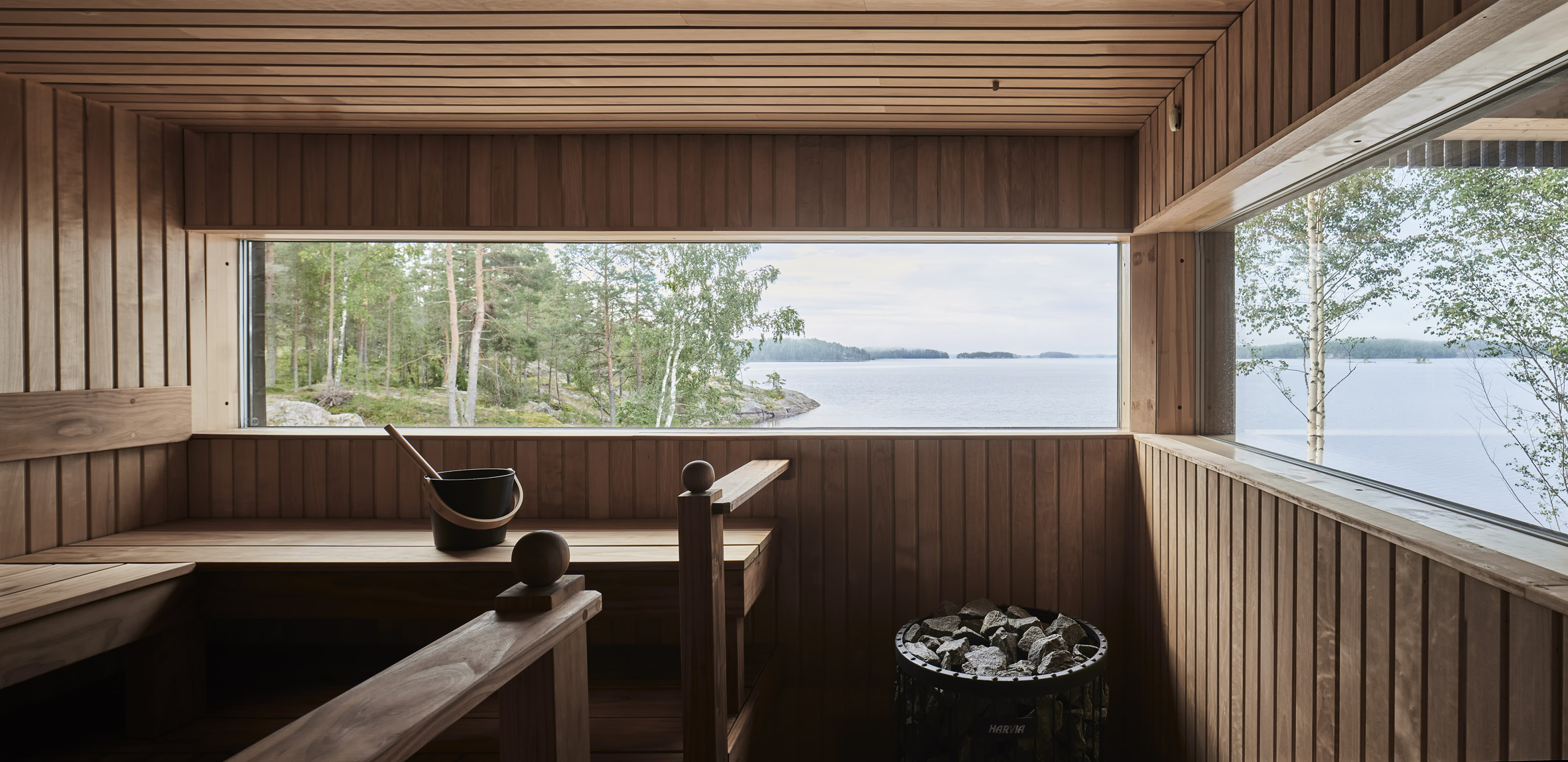 Wood-lined sauna by Studio Puisto
