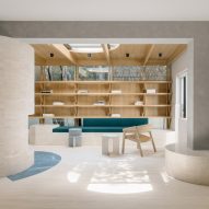 Atelier Tao+C creates serene timber and travertine reading room
