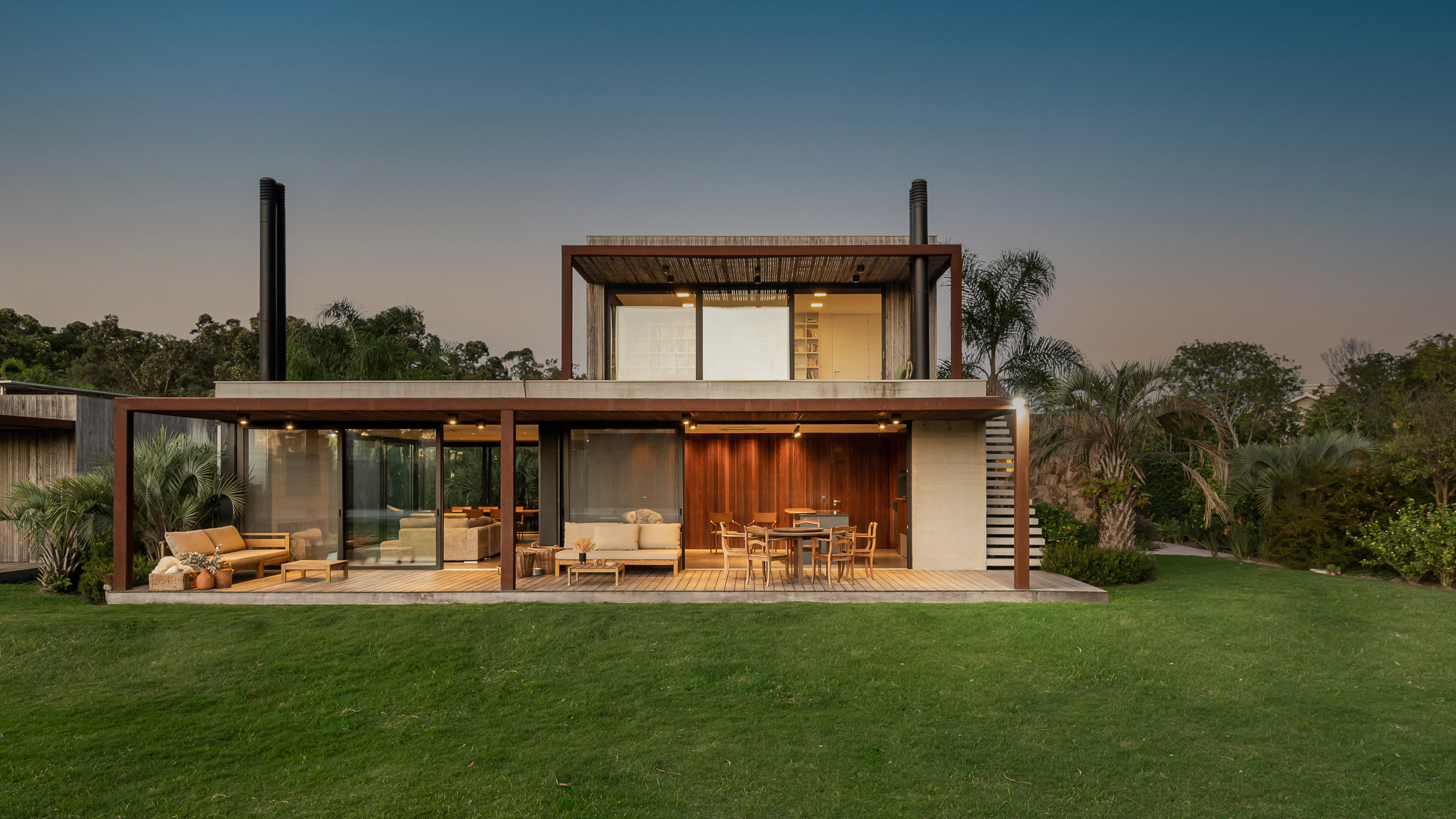 Stone, wood and concrete feature in RMK Arquitetura's Casa Pampas - Vimarsana News