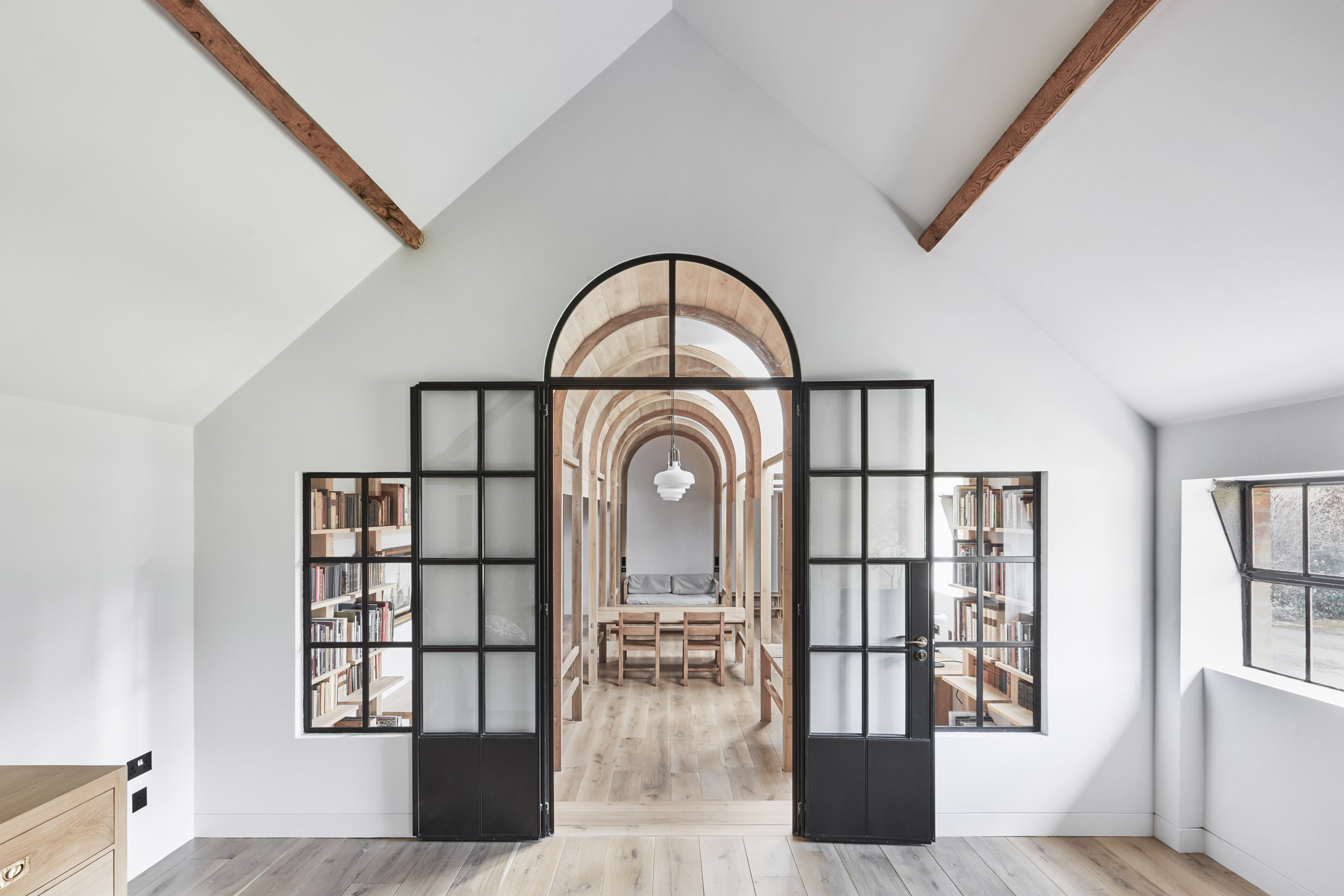 White-walled room in Stanbridge Mill Library by Crawshaw Architects