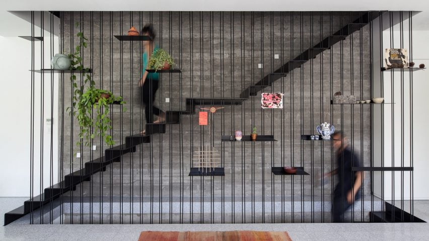 Vertical full-height rods were used as a balustrade in a Tel Aviv home