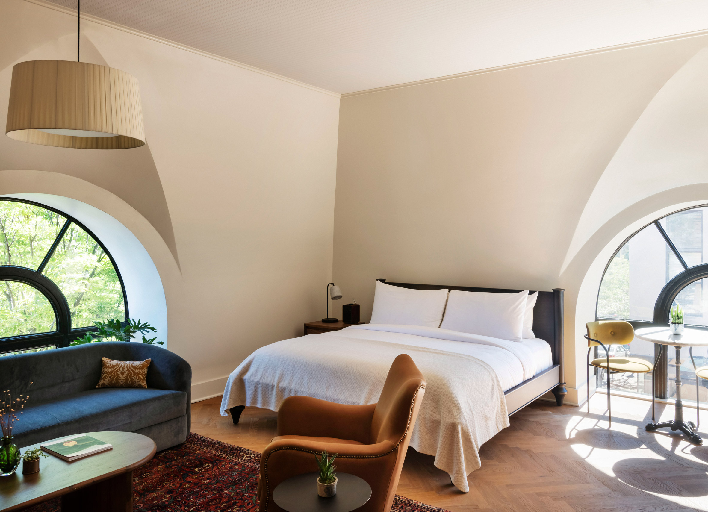 Bedroom with arched cove windows