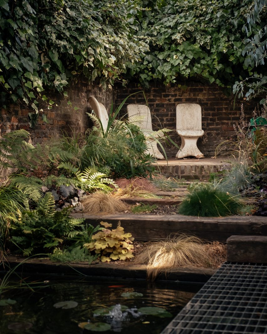 Walled garden with pond in London