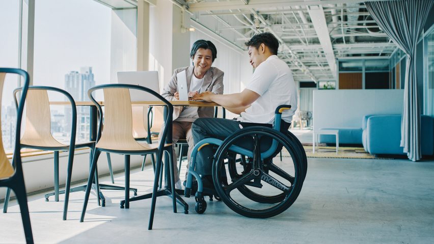 Wheelchair user at office work table